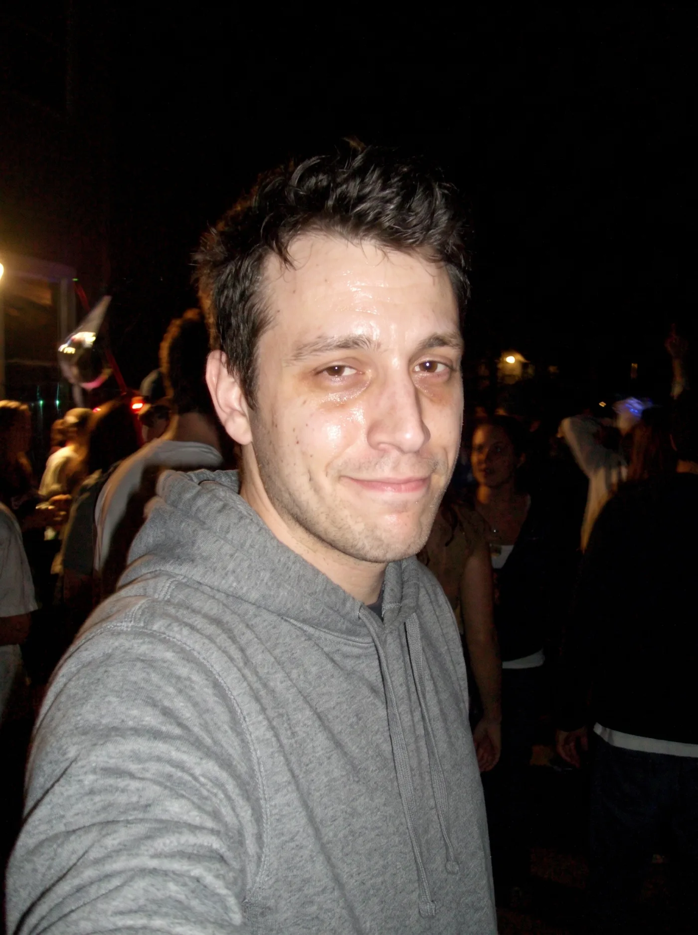 AI-edited Y2K digicam-style flash photo of the same man at night.