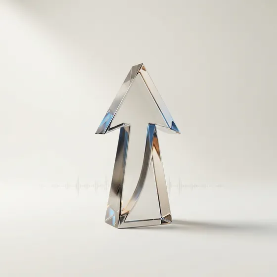 February 2026 Clicky Wrap cover: a polished trophy shaped like an upward arrow on an off-white surface, catching Clicky blue and amber light.