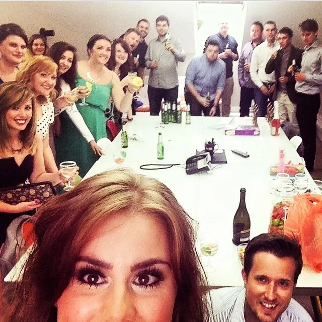 The team raising a toast with champagne