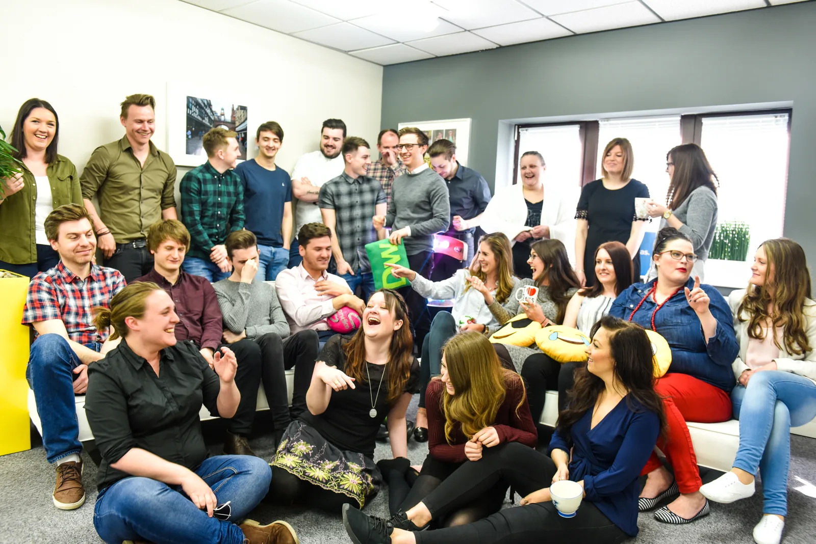 A big relaxed group shot of the whole team