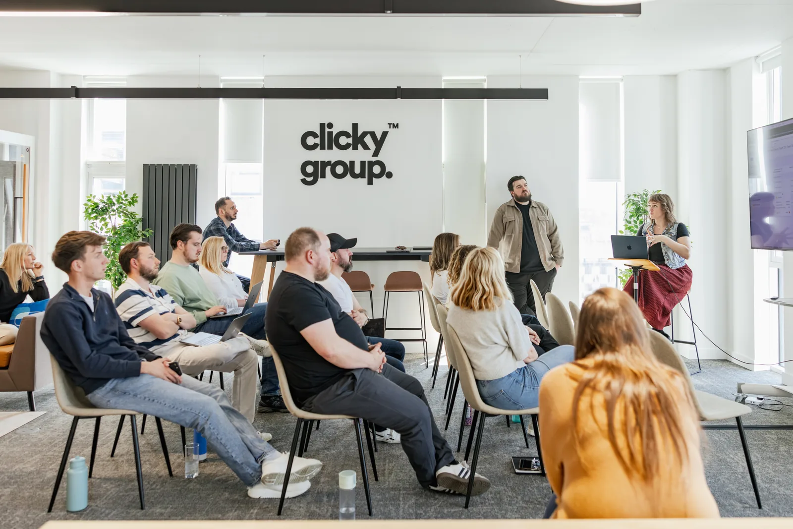 The team seated for Agency Day under the Clicky Group wall