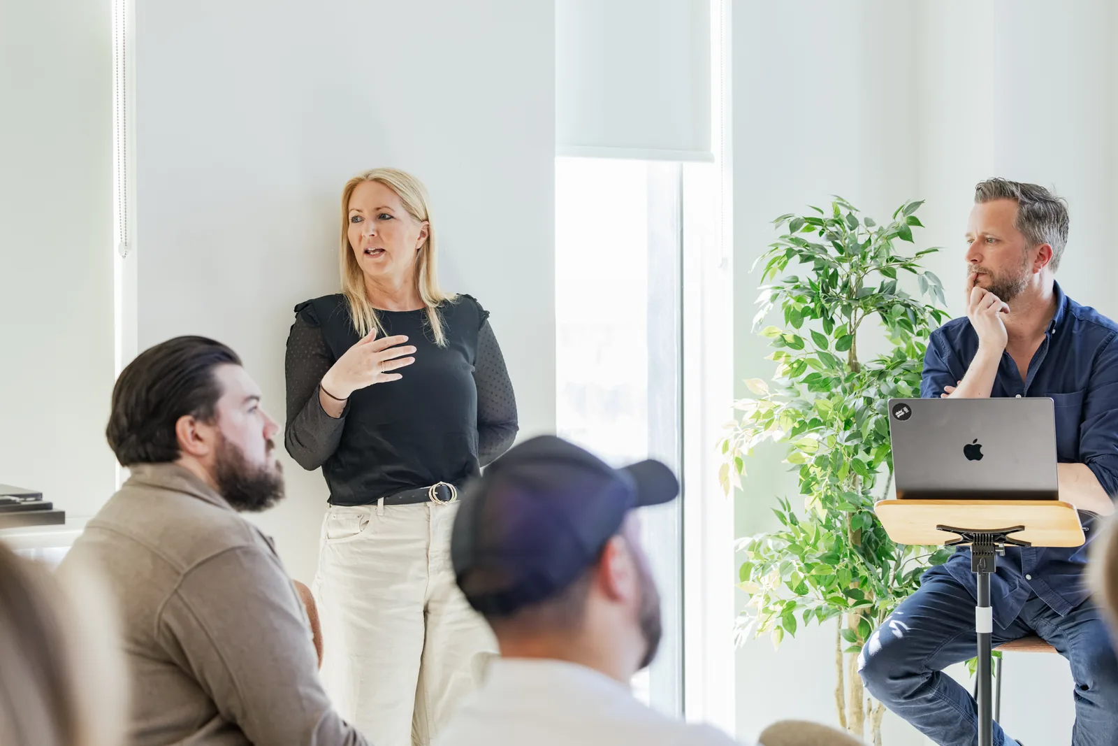 A team member presenting to the room at Agency Day
