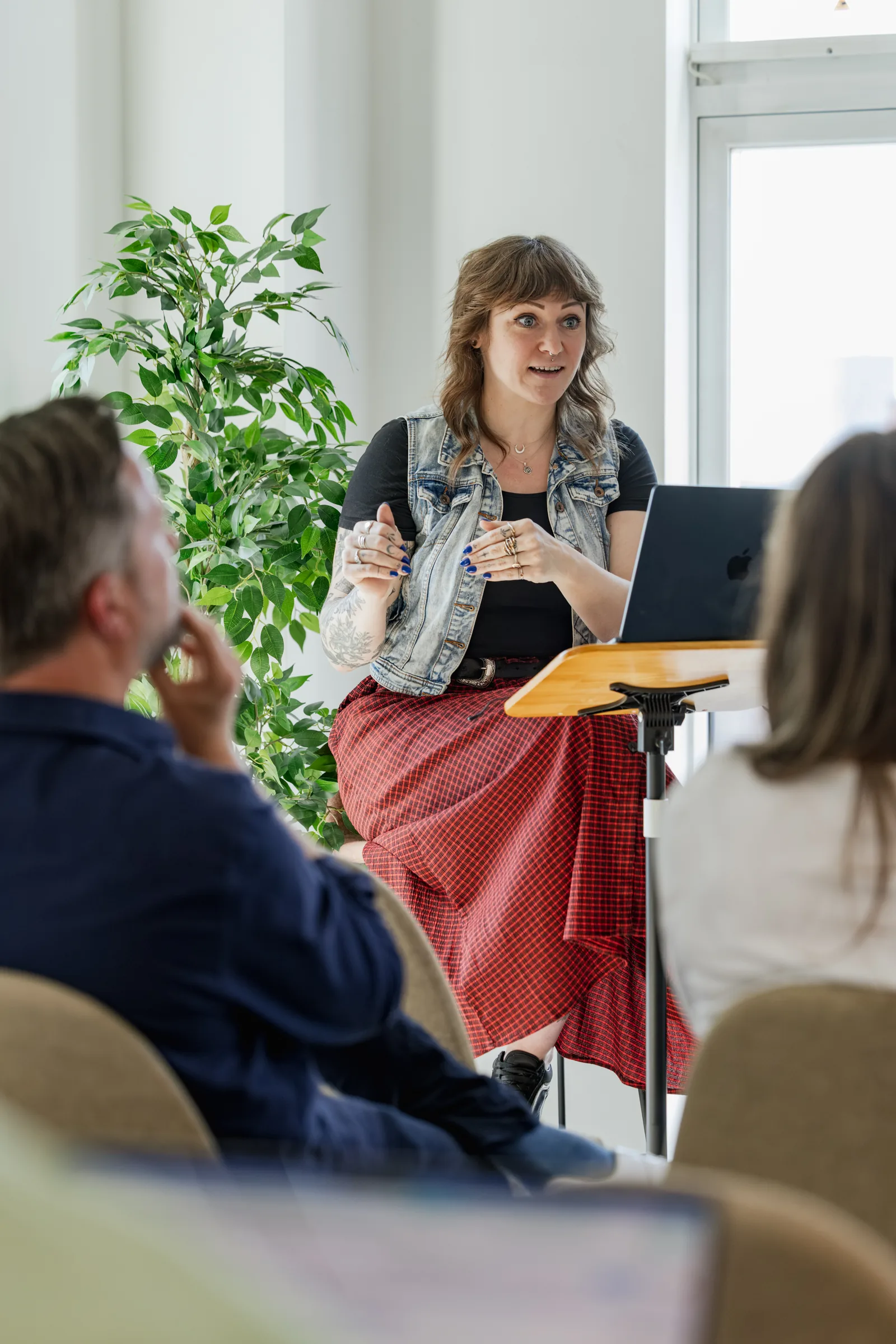A team member presenting to colleagues at Agency Day