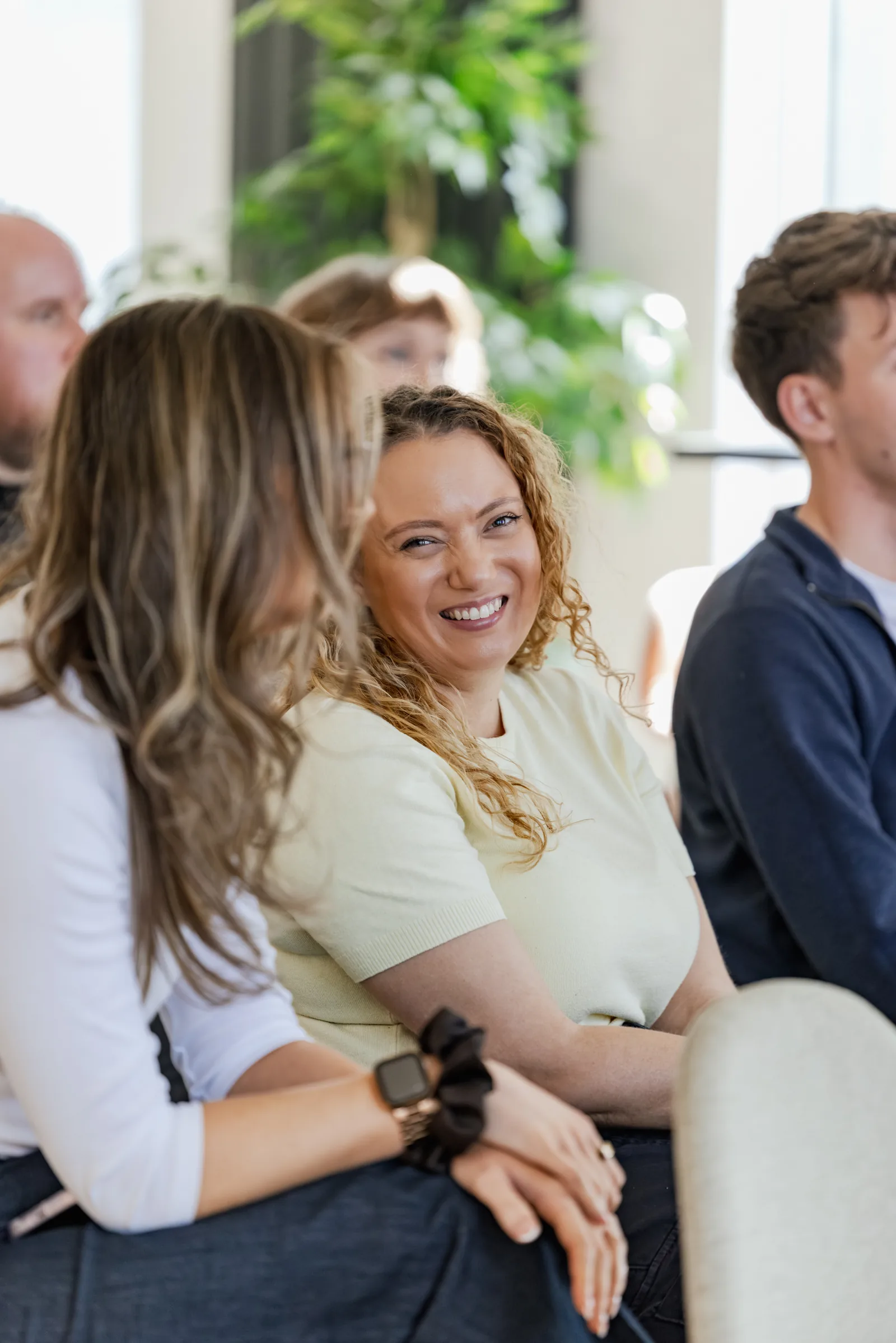 Two colleagues laughing together at Agency Day